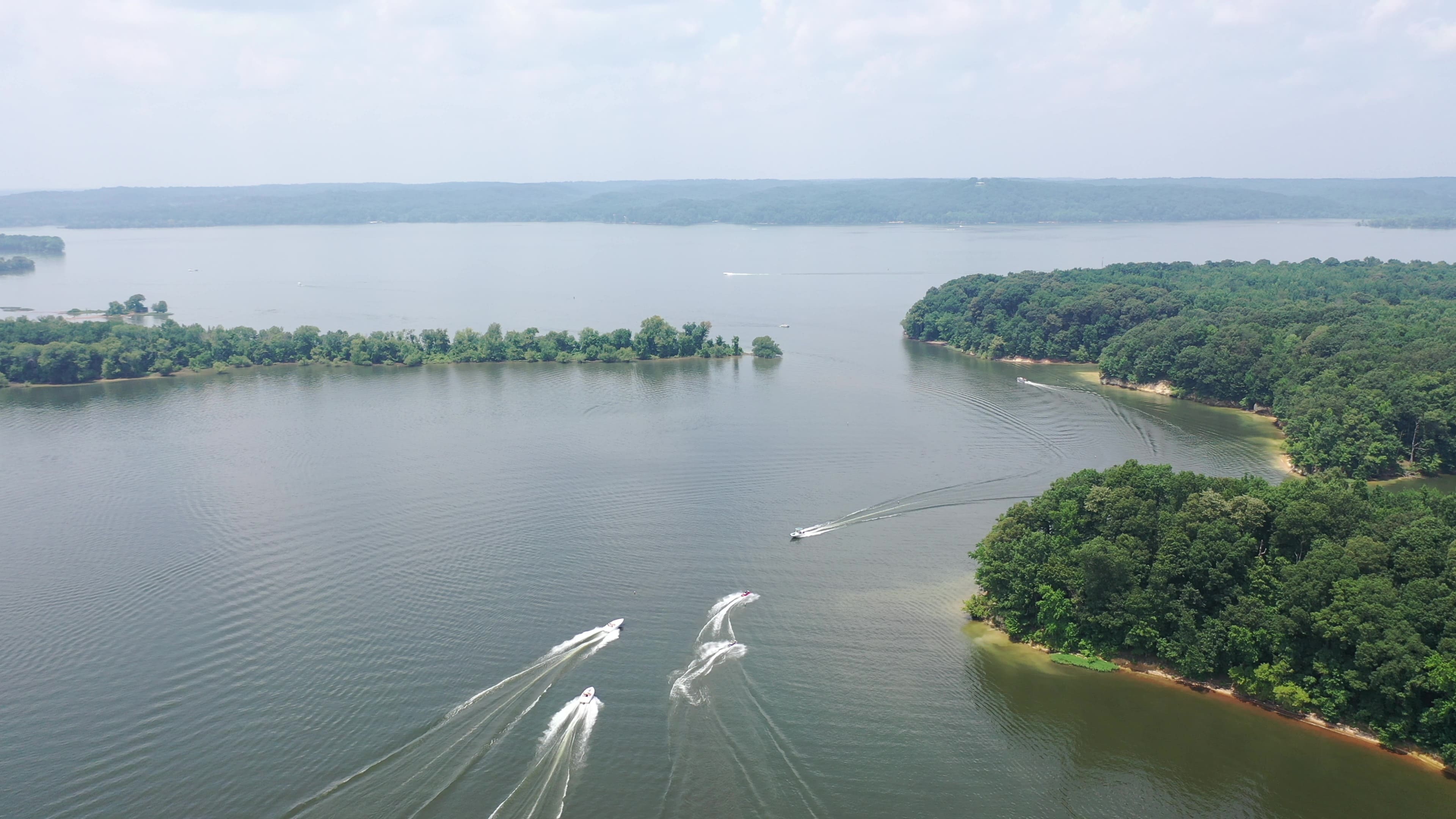 Overview of Kentucky Lake boat slip with trees and and open lake.